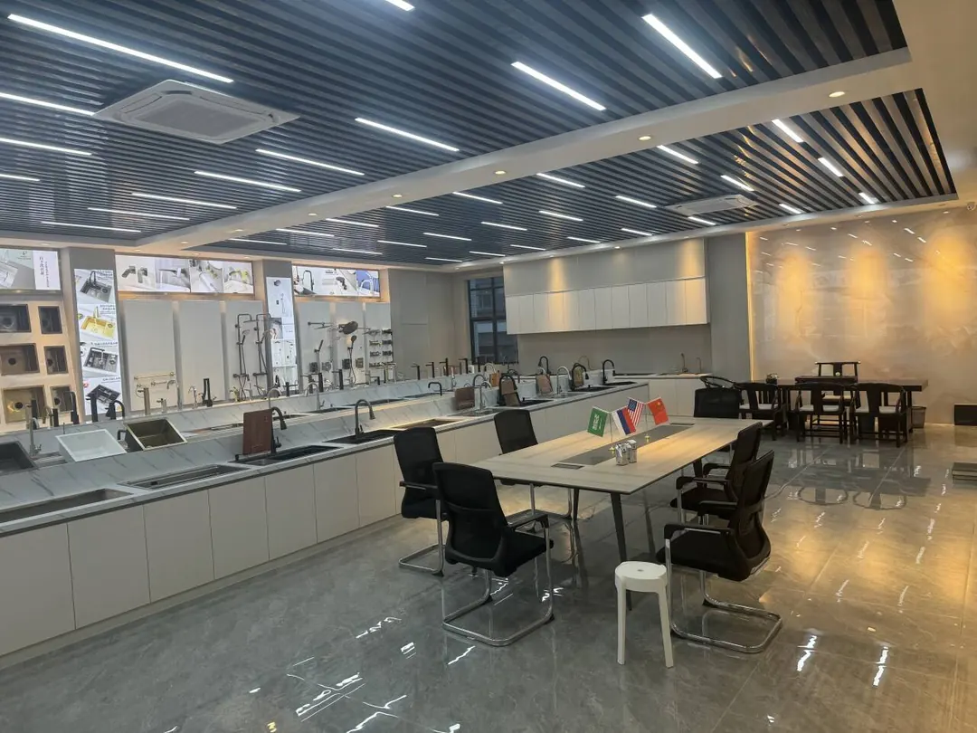 Fengyin Kitchenware showroom — stainless steel sink and faucet display hall with meeting area